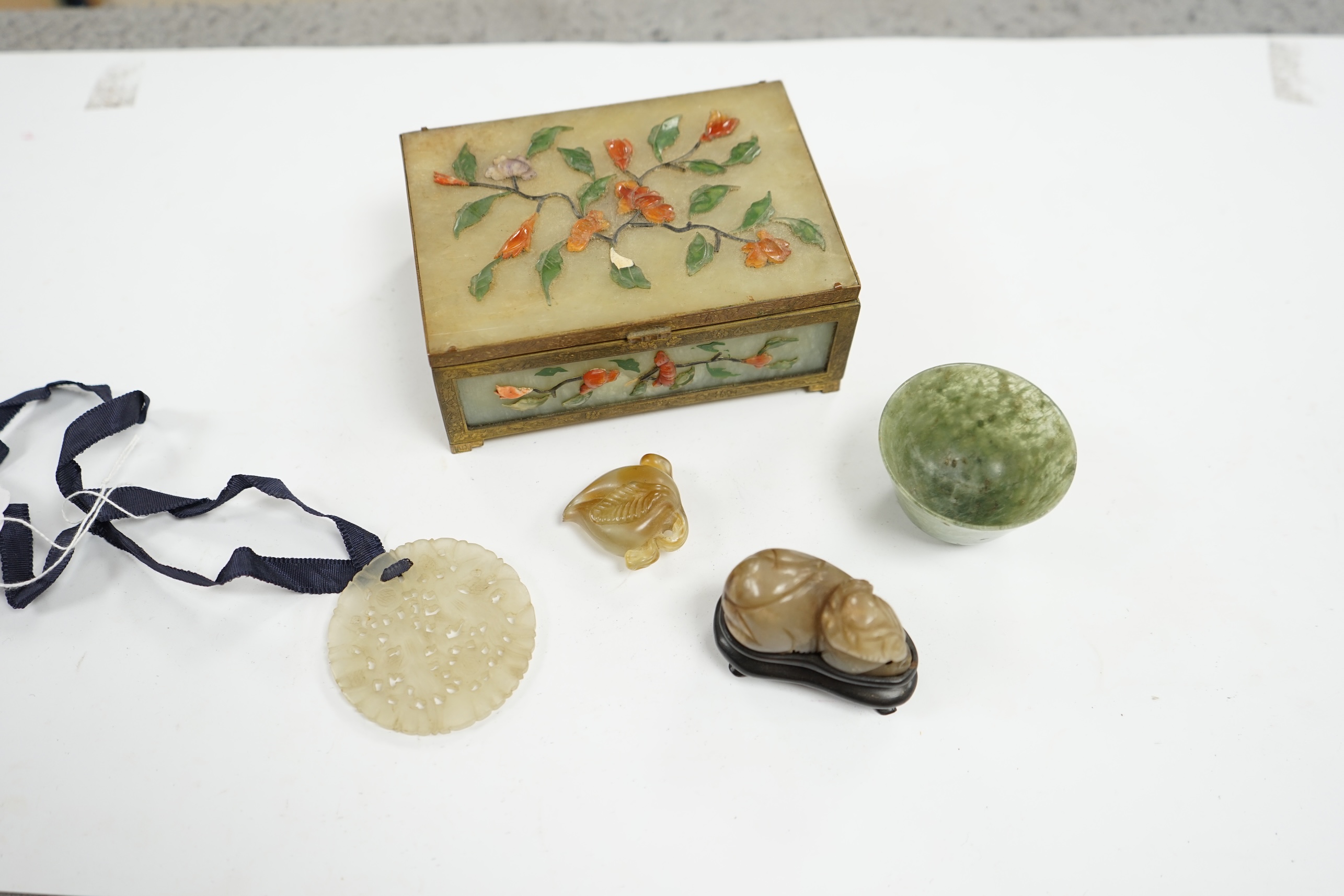 A group of Chinese jade and hardstone carvings to include a cigarette box & cover and a 14K mounted Yamanaka & Co pouch, largest 13cm wide. Condition - mostly fair